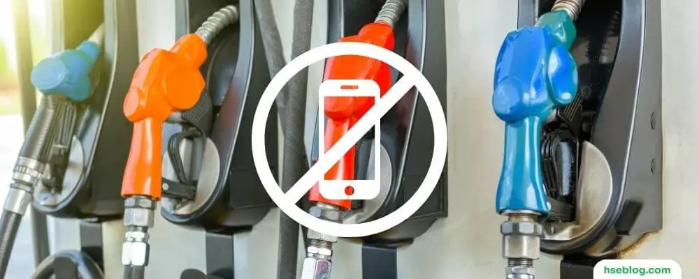 Using Phone At Petrol Station