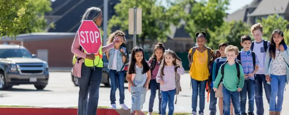Walking On The Street Road With Children